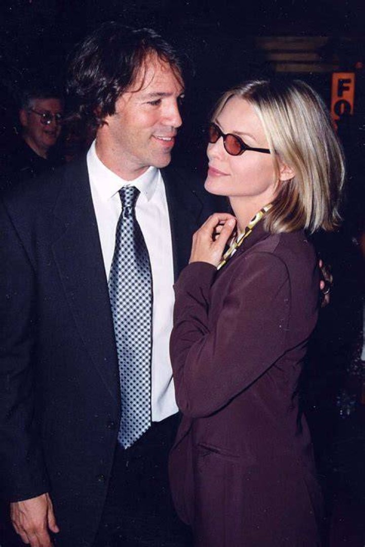 Actress Michelle Pfeiffer and David E. Kelley pose during the 9th Annual Screen Actors Guild Awards at the Shrine Auditorium on March 9, 2003 in Los Angeles, California. | Source: Getty Images