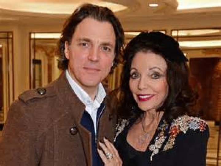Alexander Newley and Dame Joan Collins attend a festive afternoon tea hosted by patron Dame Joan Collins for Shooting Star Chase supported children and their families at The Dorchester on December 19, 2018 in London, England | Source: Getty Images