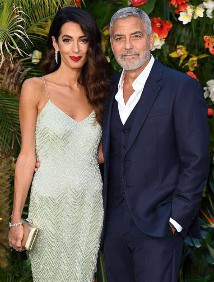 Amal Clooney and George Clooney arriving at the premiere of Universal Pictures' "Ticket To Paradise" on October 17, 2022, in Los Angeles, California | Source: Getty Images