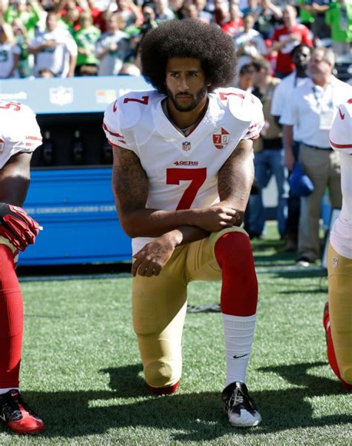Colin Kaepernick pictured as he interacts with fans during the Michigan spring football game at Michigan Stadium in Ann Arbor | Source: Getty Images