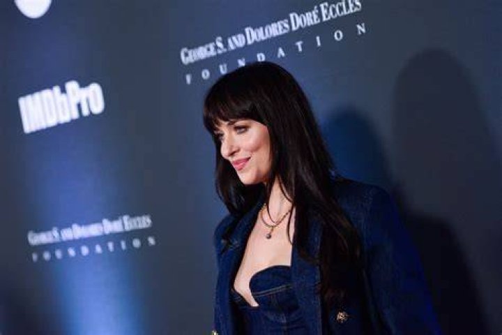 Dakota Johnson attends the opening event for the Michael Kors Ginza Flagship Store in Tokyo, Japan on November 20, 2015 | Source: Getty Images