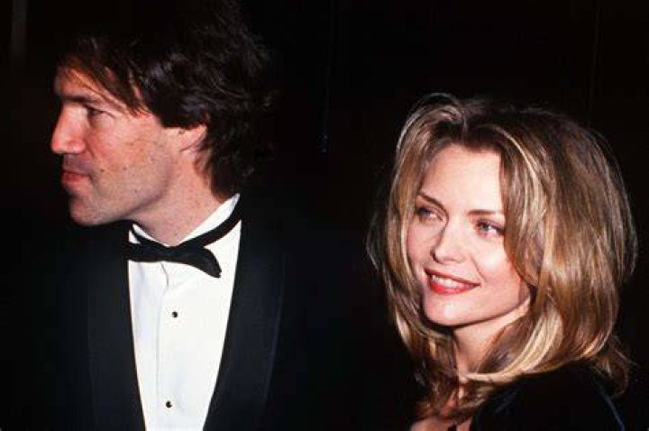 David E. Kelley and Michelle Pfeiffer at Will Rogers State Park in Pacific Palisades, California, United States on November 17, 1996 | Source: Getty Images