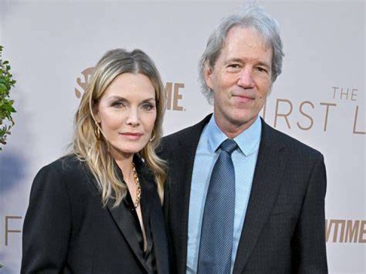 David E. Kelley and wife Michelle Pfeiffer arrive at the opening night for the Broadway revival of "Come Back, Little Sheba" at the Biltmore Theater January 24, 2008 in New York City. | Source: Getty Images