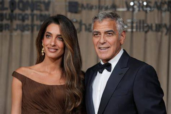 George Clooney and his wife Amal Clooney attending the "Money Monster" premiere at the Palais des Festivals on May 12, 2016, in Cannes, France | Source: Getty Images