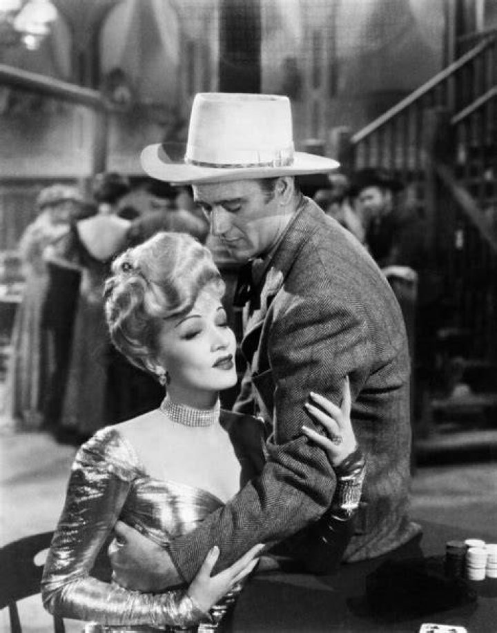 John Wayne, Marlene Dietrich on the set of "The Spoilers" directed by Ray Enright circa 1942 | Source: Getty Images