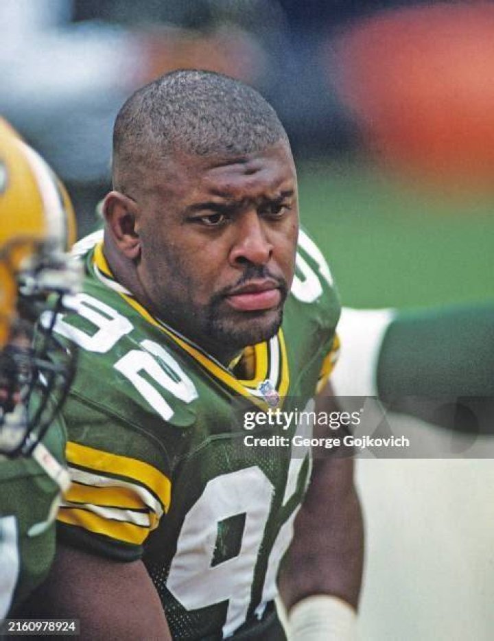 Reggie White looks on from the sideline during a game against the Cleveland Browns at Cleveland Municipal Stadium on October 16, 1988 in Cleveland, Ohio. | Source: Getty Images