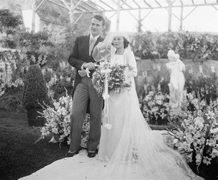  Screen actor Weds Daughter Of Latin American Consul. John Wayne, motion picture actor, and his bride, the former Miss Josephine Saenz, Panamanian Consul in Los Angeles, shown after their marriage at the Los Angeles home of Loretta Young,| Source: Getty Images