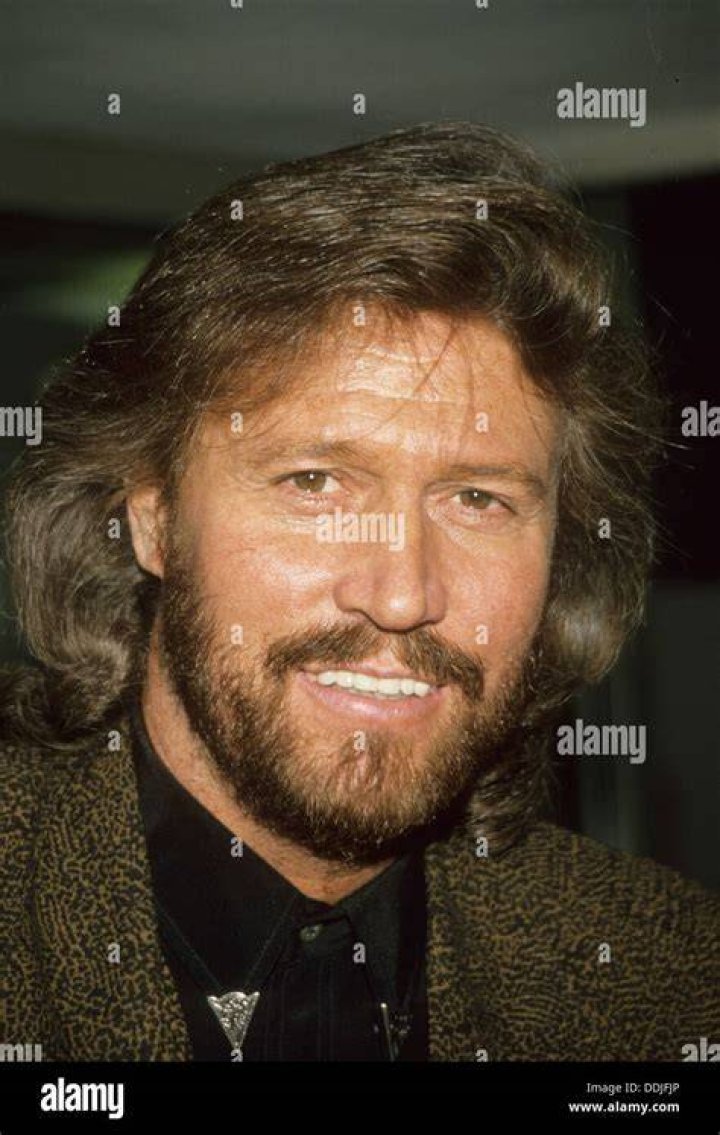 Singer and songwriter Barry Gibb poses for a photo ahead of being knighted during an investiture ceremony at Buckingham Palace on June 26, 2018 in London, England | Source: Getty Images