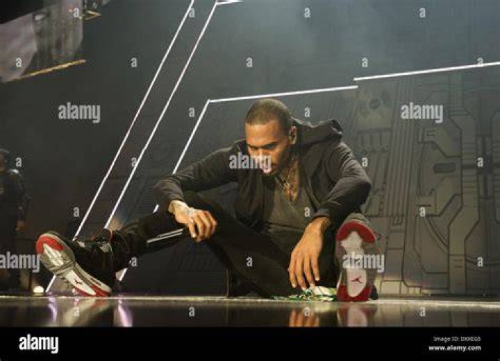 Singer Chris Brown during his 2017 performance onstage at Little Caesars Arena in Detroit, Michigan. | Photo: Getty Images